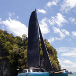 catamaran with black sails